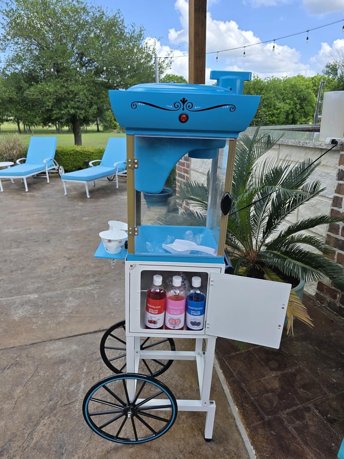 Nostalgia Snow Cone Shaved Ice Machine - Retro Cart Slushie Machine Makes 48 Icy Treats - Includes Metal Scoop, Storage Compartment, Wheels for Easy Mobility - White, Blue customer photo 1