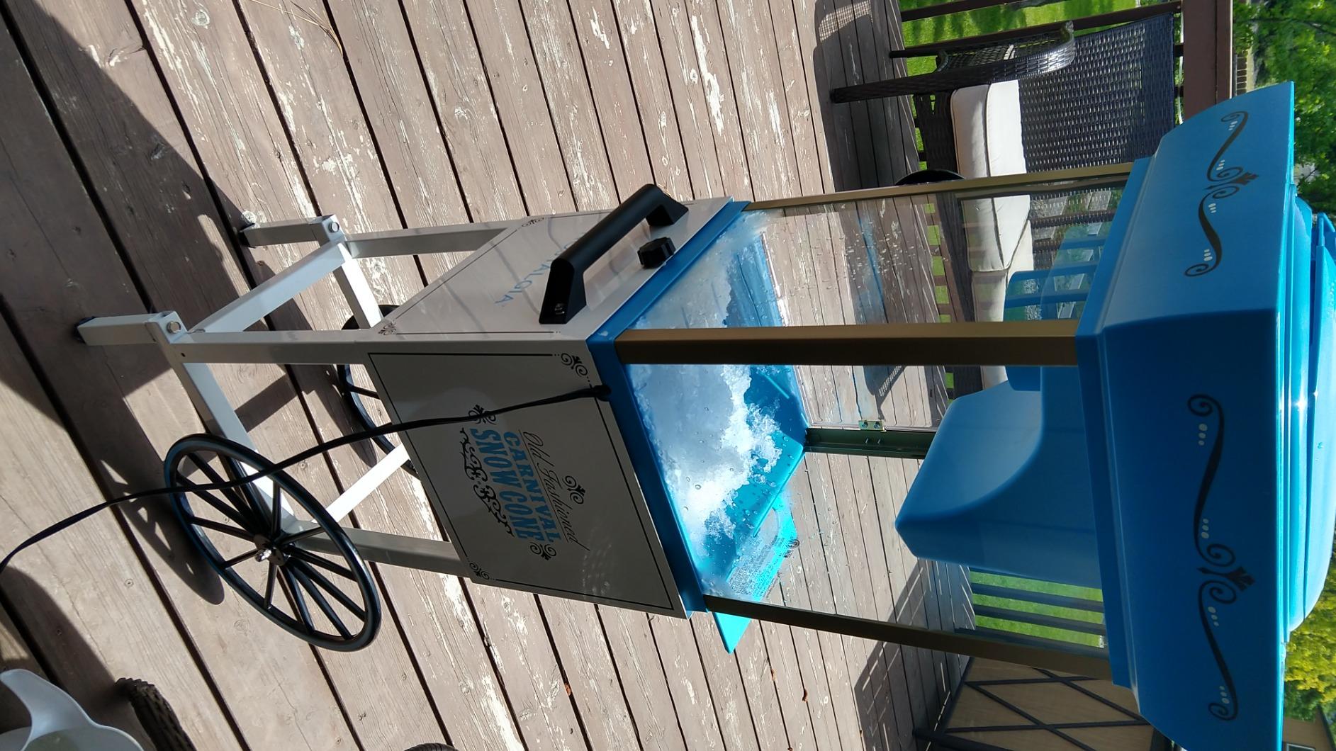 Nostalgia Snow Cone Shaved Ice Machine - Retro Cart Slushie Machine Makes 72 Icy Treats - Includes Metal Scoop, 2 Syrup Bottles, 100 Paper Cups/Spoons, Storage Compartment, Wheels - Blue, 54