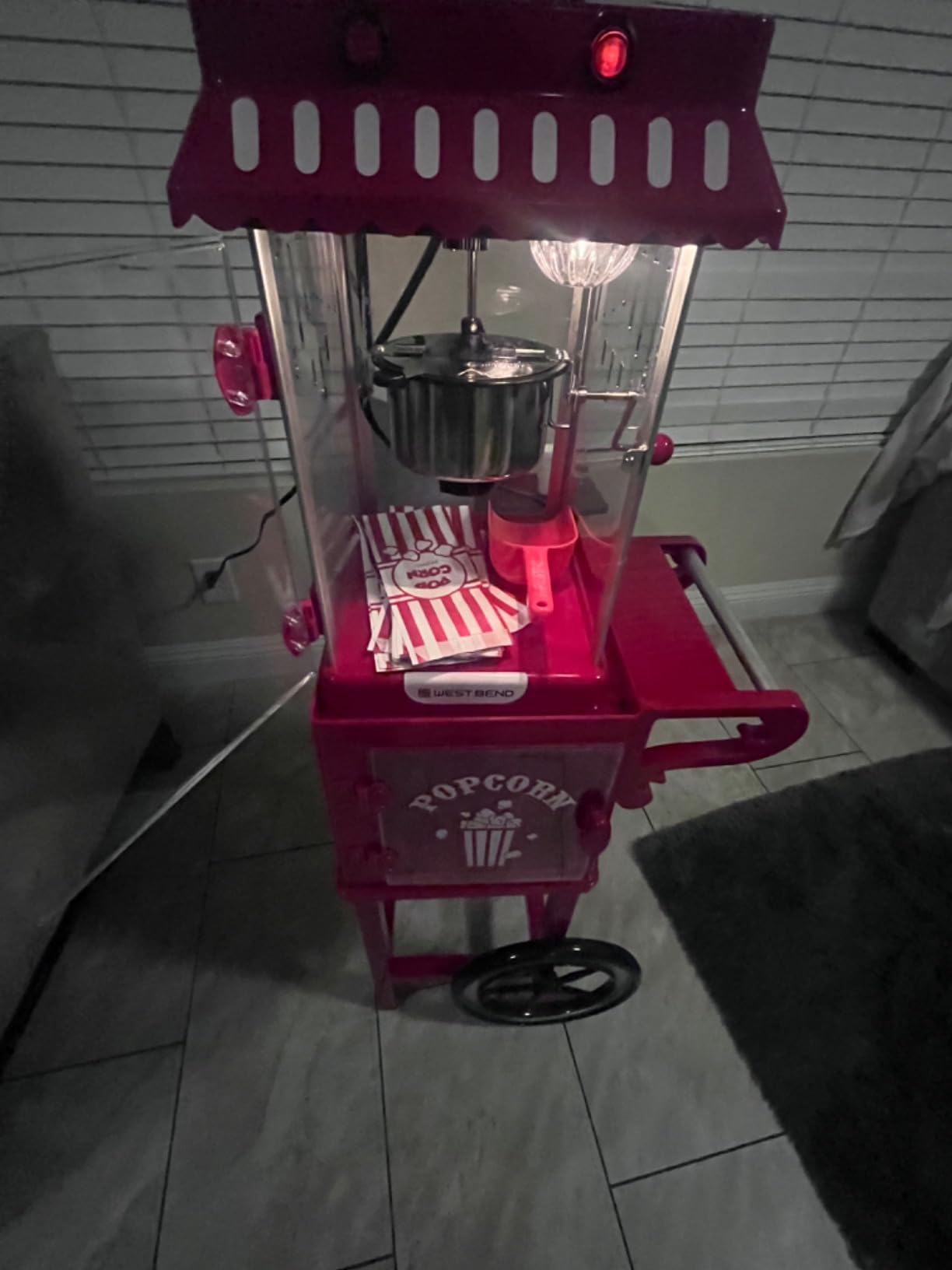 West Bend Popcorn Cart Vintage Theater Style with 2.5 oz Stainless Steel Kettle, Removable Serving Tray, Built-In Storage, Portable Design, 10 Cup Capacity, in Red/Silver customer photo 2